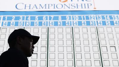 Tiger Woods walks off the course. AFP