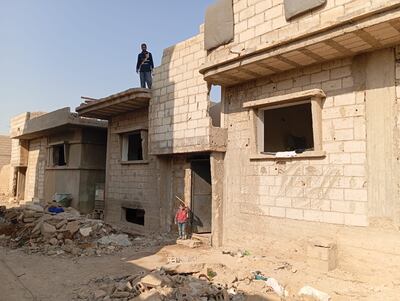 Ibrahim Mohammed Hussein stands above the ruins of his home in Palmyra. Photo: Civil Committee of Tadmur
