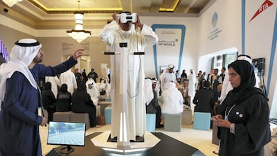 A delegate watching the virtual reality show 2050 Abu Dhabi & Dubai in the World Government Summit 2017 held at Madinat Jumeirah in Dubai Pawan Singh / The National