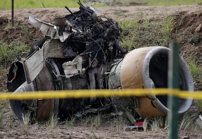 A jet engine of a Saurya Airlines plane that caught fire after skidding off the runway while taking off at Tribhuvan International Airport lies at the crash site in Kathmandu. Reuters
