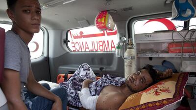 An unidentified wounded man waiting in a ambulance about to cross the Rafa Gaza Egypt border for medical treatment in Egypt. Heidi Levine for The National