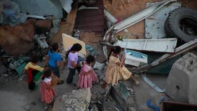 Fresh from training in the UAE, a group of telecommunications workers is building a mobile phone network in the battle-torn Libyan city of Misurata, where these children are pictured playing.