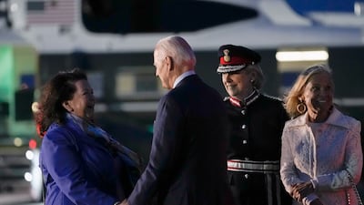 Mr Biden speaks with Ms Pierce as Ms Tolhurst and Ms Hartley look on. AP