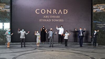 Staff celebrate the opening of Conrad Abu Dhabi Etihad Towers. Jonathan Gibbons