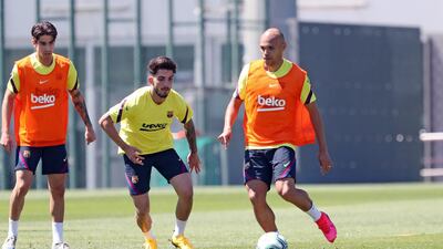 Martin Braithwaite controls the ball under pressure from Alex Collado (L) and Ramon Rodriguez 'Monchu' (C) during a training session at Ciutat Esportiva Joan Gamper. Getty Images