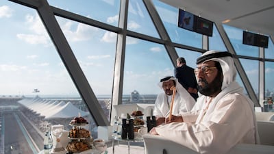 Sheikh Tahnoon bin Mohammed, Ruler's Representative in Al Ain Region (R) and Sheikh Saeed bin Mohammed Al Nahyan (2nd R), attend the final day of the 2017 Formula 1 Etihad Airways Abu Dhabi Grand Prix, in Shams Tower. Saeed Al Neyadi / Crown Prince Court - Abu Dhabi