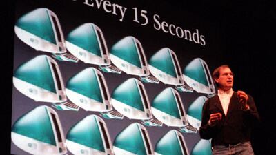 File - Steve Jobs, Apple's interim chief executive, gives the keynote address at the beginning of the MacWorld Expo in San Francisco, Tuesday, Jan. 5, 1999. Jobs speaks in front of a projected image of iMac computers, which Apple has sold 800,000 of sinc???