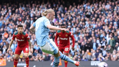 Erling Haaland of Manchester City scores the opener. EPA