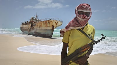 A Taiwanese vessel that washed ashore in Somalia after being hijacked in 2012. Two recent ship hijackings in the waters off Somalia are reported to have been carried out by pirates operating under the protection of Al Shabab militants. Farah Abdi Warsameh / AP