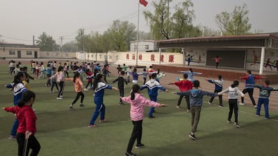 Pupils do their morning exercise at a school on the outskirts of Beijing, China. AFP