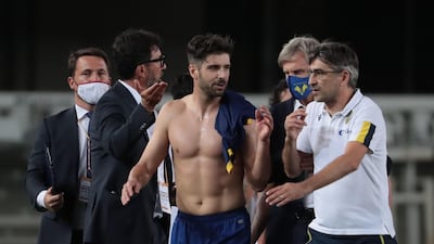 Verona's head coach Ivan Juric and midfielder Miguel Veloso celebrate victory at the end of the match. EPA