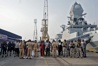 Troops escort captured Somali pirates after they were brought in for prosecution by the Indian Navy, at the naval dockyard in Mumbai. Reuters