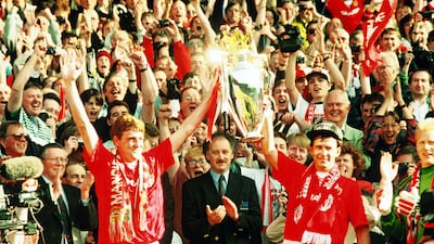 Steve Bruce and Bryan Robson lift the trophy after winning the Premiership in the 1993-94 season with 92 points. Getty