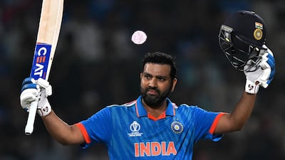 India's captain Rohit Sharma celebrates his century in the Men's Cricket World Cup match against Afghanistan at the Arun Jaitley Stadium in New Delhi on October 11, 2023. AFP