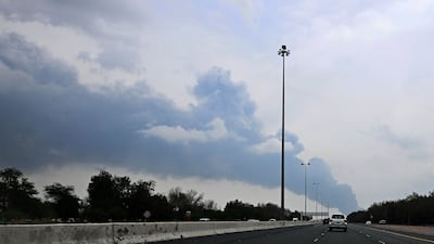 Smoke rises from the area of the Kuwait International Airport after a reported drone strike hit a fuel depot on March 25. AFP