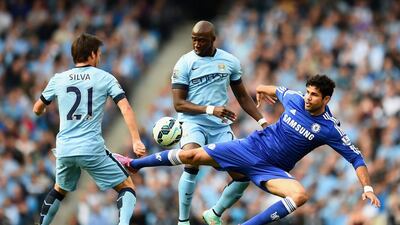 David Silva, left, and Eliaquim Mangala, centre, of Manchester City compete with Diego Costa of Chelsea during their Premier League match at the Etihad Stadium on September 21, 2014, in Manchester, England. Shaun Botterill / Getty Images