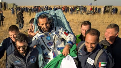UAE astronaut Hazza al-Mansouri is carried from the landing site. AFP / NASA