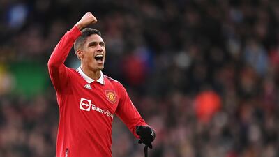 Raphael Varane celebrates the win over Manchester City with the fans. Getty