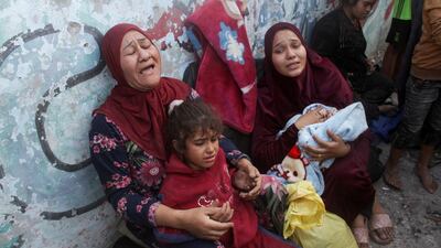 A Palestinian woman weeps after an Israeli strike hit a school sheltering displaced people in Al Shati camp in Gaza city. Reuters