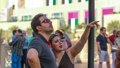 Passersbys check out the damage caused by the blaze.