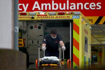 A paramedic moves a stretcher at St Thomas’s Hospital, London. Getty