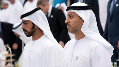 Dr Ahmed Abdullah Humaid Belhoul Al Falasi, UAE Minister of State for Higher Education (R) and Sheikh Khalifa bin Tahnoon bin Mohamed, Director of the Martyrs' Families' Affairs Office of the Abu Dhabi Crown Prince Court (L), stand for the national anthem prior to an equestrian performance by the Spanish Riding School of Vienna, at Emirates Palace. Ryan Carter / Ministry of Presidential Affairs