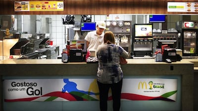 It is not the hotels and flights that will break wallets for fans visiting Brazil for the World Cup. It is the USD$17 cheeseburgers or that $35 pepperoni pizza. Football visitors will quickly learn that Brazil is astoundingly expensive. Hassan Ammar / AP Photo
