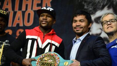 Floyd Mayweather Jr, left, and Manny Pacquiao were all smiles during Thursday's media conference. Michael Nelson / EPA
