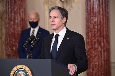 US Secretary of State Antony Blinken speaks at the US State Department as President Joe Biden listens, Washington, February 4, 2021. AFP