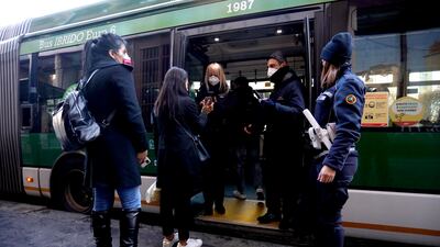 Passengers at a metro station in northern Italian city of Milan are being screened for Covid-19 vaccine certificate. EPA