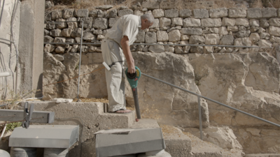 The film contains many long moments of the town's residents cleaning their homes and doing housework. Photo: Reel Palestine