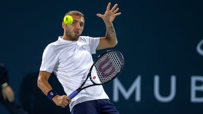 Daniel Evans returns a shot to Andy Murray during their match at the Mubadala World Tennis Championship. Victor Besa / The National