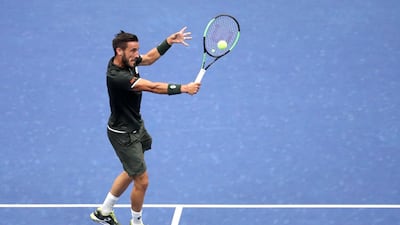 Damir Dzumhur a returns a shot during his second round match against Roger Federer. AFP