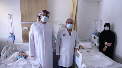 Parents Rashid Al Hasani and Mona Ali, with their baby twins and Dr Hussein Matlik of Burjeel Hospital. Burjeel Hospital