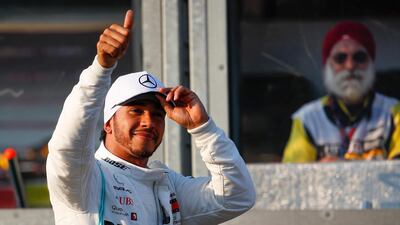 Lewis Hamilton reacts after taking pole position in qualifying ahead of the Australian Grand Prix at Albert Park in Melbourne. Diego Azebel / EPA