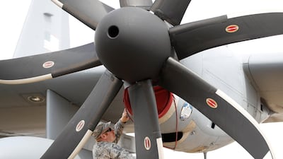 A technician works on a US C-130 Hercules. Reuters