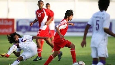 The UAE, in red, and Al Ain played out a 3-3 draw at Khalifa bin Zayed Stadium yesterday, before Al Ain won 6-5 in a penalty shootout.