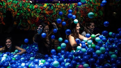 People play in a ball pit at Ballie Ballerson in Shoreditch, London. Jack Taylor/Getty Images