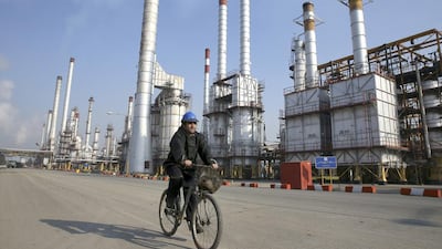 The oil sanctions on Iran will not be lifted until the end of the year, only after the International Atomic Energy Agency issues a report in mid-December. Vahid Salemi / AP Photo