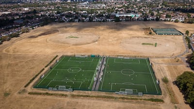 Football being played on synthetic surfaces alongside cricket matches on drought-damaged fields in Gunnersbury Park, London, on August 22, 2026. Getty Images