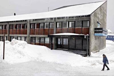 A man walks past the Inartsisartut, Greenland's parliament building, in the centre of Nuuk, Greenland. AFP