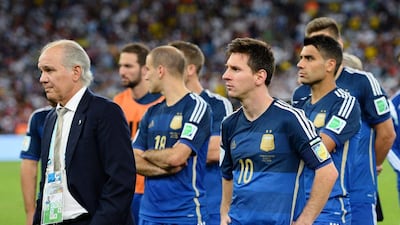 Coach Alejandro Sabella of Argentina, left, looks on with Lionel Messi after being defeated by Germany 1-0 in extra time during the World Cup final match between Germany and Argentina at Maracana on July 13, 2014 in Rio de Janeiro, Brazil. Jamie McDonald/Getty Images