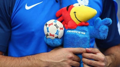 A French supporter holding the soft toy of Footix, mascot of 1998 Fifa World Cup is seen prior to the Uefa Euro 2016 Group A match between France and Romania at Stade de France on June 10, 2016 in Paris, France. (Clive Rose/Getty Images)