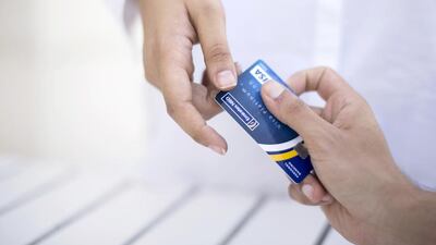 Current regulations in the UAE authorise banks to levy an additional charge on merchants for both credit and debit card transactions. Reem Mohammed / The National