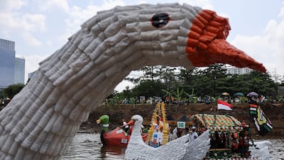 People sail on boats made from recycled materials, mostly plastic bottles, during Love the Environment Festival, held on the Ciliwung, one of the world's most polluted rivers, in Jakarta, Indonesia. Reuters