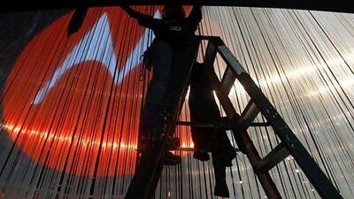 If Google's move to buy Motorola Mobility pays off, it will be able to make its software and new devices endemic. Above, a Motorola booth in Las Vegas. Isaac Brekken / AP Photo