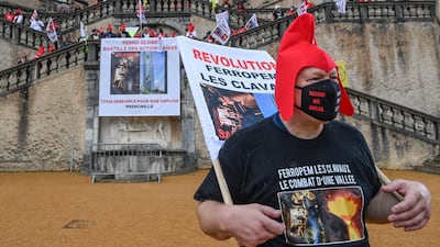 A senior leader of French leftists, supporters of whom are pictured re-enacting the Storming of the Bastille, has suggested a 90 per cent wealth tax. AFP