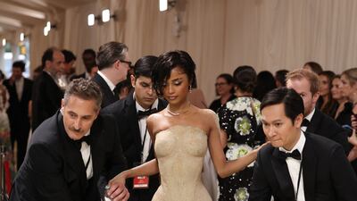 Tyla wears a dress covered in sand by Balmain. Reuters