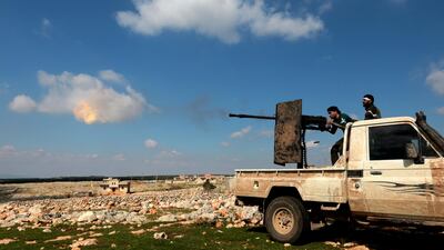 Turkey-backed Free Syrian Army soldiers shoot with heavy machine gun during an offensive, at Der Mismis Village, southeast of Afrin, Syria, 13 March 2018. EPA/STR
