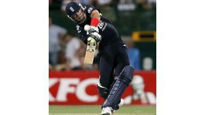 Chris Woakes hits a four on his way to a vital unbeaten 19 that helped England to beat Australia in a dramatic last-ball finish. David Gray / Reuters